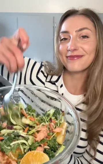 A happy Hungryroot customer enjoying a fresh salad