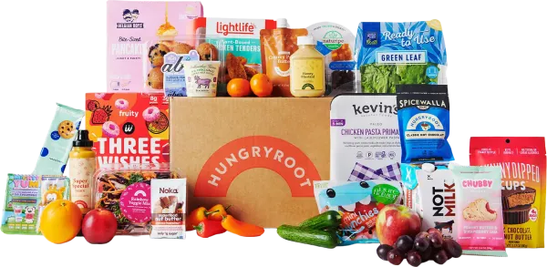 A Hungryroot box surrounded by a colorful spread of fresh groceries