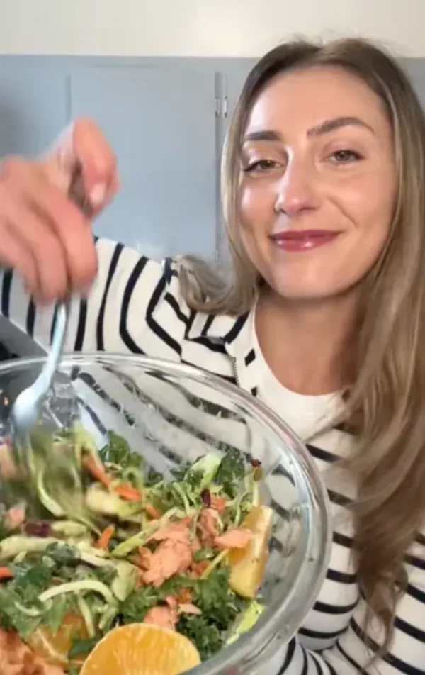 A happy Hungryroot customer enjoying a salad