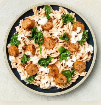 Creamy rotini pasta with sausage and spinach