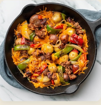 A cheesy sausage and pepper skillet stir-fry