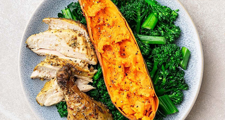 Juicy Baked Chicken + Sweet Potato on a Broccoli Bed
